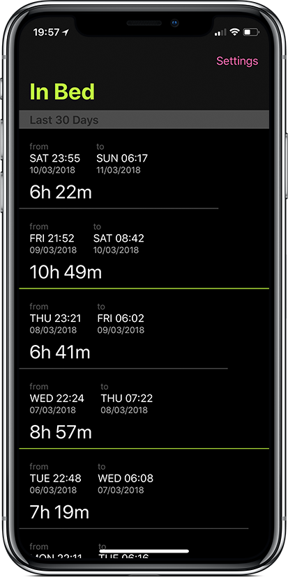 An iPhone X showing a list of sleep entries for the last 30 days with a large titled that says "In Bed" in the navigation bar at the top. The entries underneath show how long the user was in bed for.